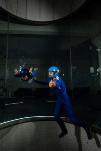 Young man with arms outstretched