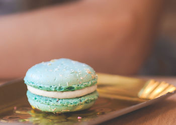 Close-up of macaroon in plate on table