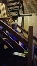 High angle view of woman sitting on table