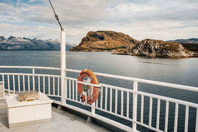 Scenic view of sea and mountains against sky