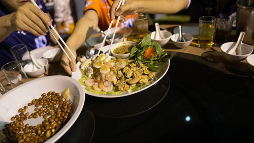 High angle view of people having food in restaurant