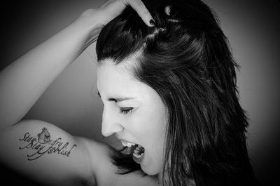 Headshot of woman with tattoo