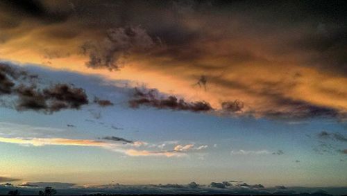 Scenic view of landscape against cloudy sky