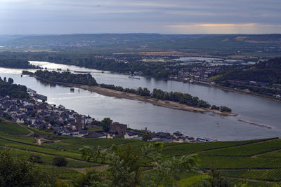 High angle view of river and cityscape against sky