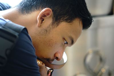 Close-up of thoughtful man at home