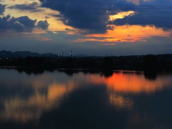 Scenic view of lake at sunset