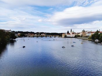 Sailboats in sea against sky