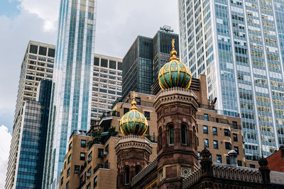 Low angle view of modern buildings against sky