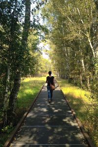 Full length of people walking on road