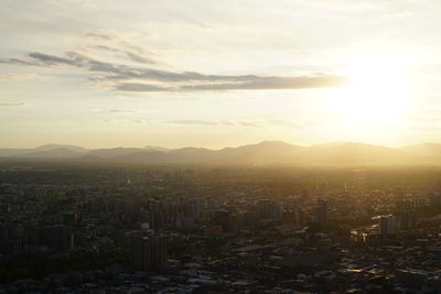 High angle view of city at sunset