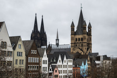 Buildings in city against sky