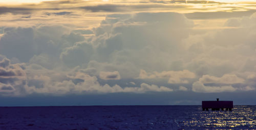 Scenic view of sea against sky at sunset