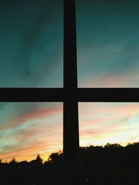 Silhouette of building at sunset