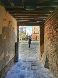 Narrow alley in tunnel