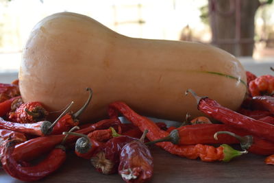 Close-up of red chili peppers on table