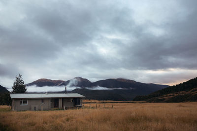 Scenic view of landscape and mountains against sky