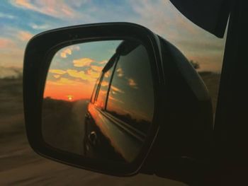 Reflection of sky on side-view mirror