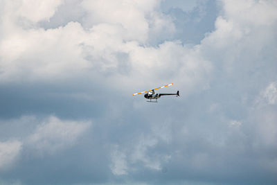 Low angle view of airplane flying in sky