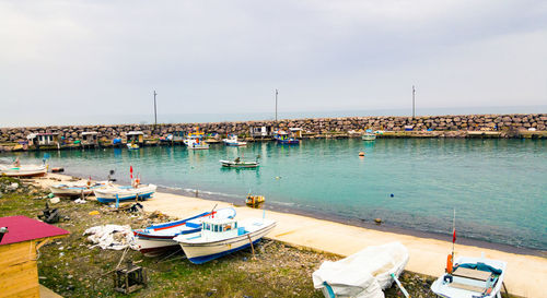 High angle view of boats moored on sea against sky