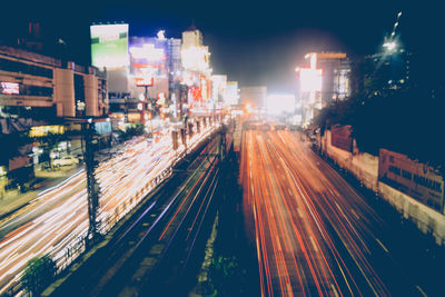 High angle view of light trails on road at night