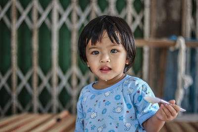 Portrait of cute girl standing outdoors