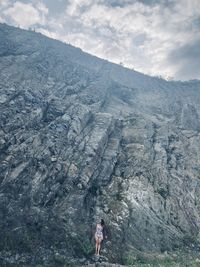 Rear view of people walking on mountain