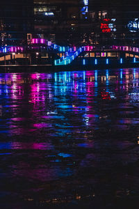 Reflection of illuminated buildings in water at night