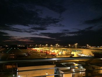 High angle view of vehicles on illuminated city at night