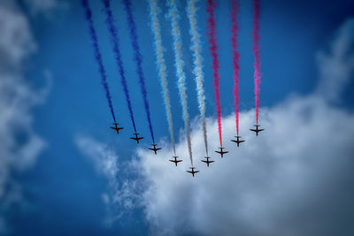 Low angle view of airshow in sky