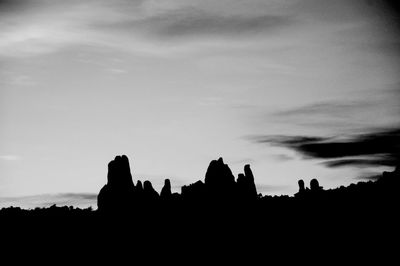 Silhouette of built structure against sunset sky