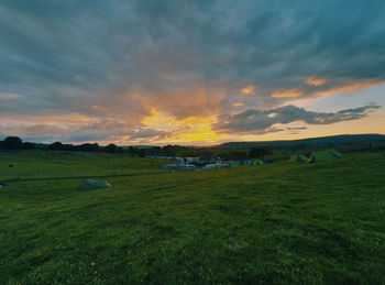 Scenic view of field against sky during sunset