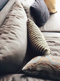 Low section of man relaxing on bed at home