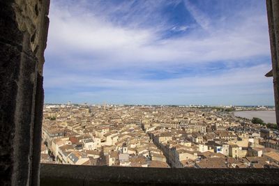 Aerial view of townscape against sky