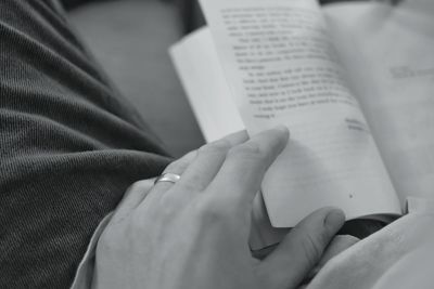 Close-up of hand holding book