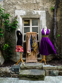 Clothes hanging on wall by building