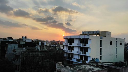 Cityscape against sky during sunset