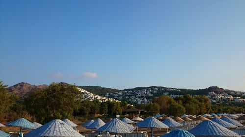 Scenic view of mountains against clear blue sky