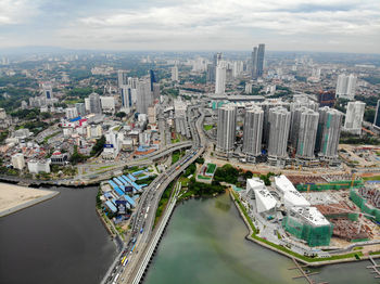 High angle view of buildings in city against sky