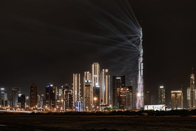 Illuminated buildings in city at night