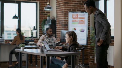 Business colleagues working at office