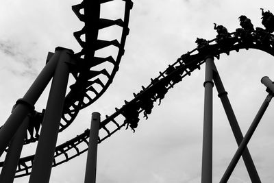 Low angle view of rollercoaster against sky