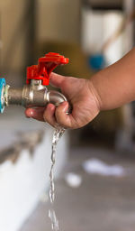 Close-up of hand holding water