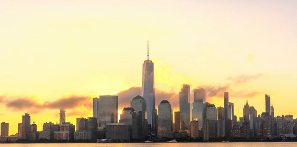 Cityscape against sky during sunset