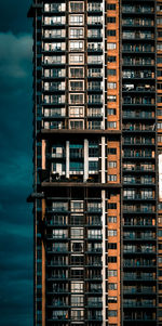 Low angle view of modern building in city against sky