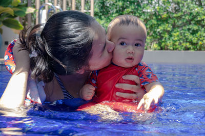 Close-up of boy swimming in pool