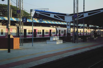 Train at railroad station against sky