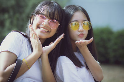 Portrait of smiling friends gesturing