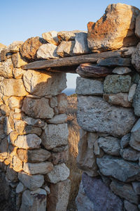 Low angle view of stone wall