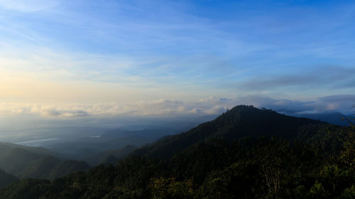 Scenic view of mountains against sky during sunset