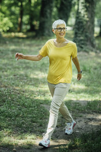Senior woman enjoying walking exercise in nature